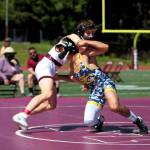 RYAN SPARKS | THE DAILY WORLD 
Montesanos Cole Ekerson, left, grapples with Seton Catholics Amman Au during the 132-pound final of the 1A District 4 Championships Saturday at Rottle Field in Montesano. Ekerson won via pinfall.