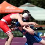 RYAN SPARKS | THE DAILY WORLD Elmas Kale Reeves, right, shoots on Castle Rocks Tony Ibsen during the 1A District 4 Championships Saturday at Rottle Field in Montesano. Reeves would go on to win the 126-pound district championship.