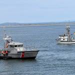 DAN HAMMOCK | THE DAILY WORLD
Coast Guard Station Grays Harbor personnel place the memorial reef at Sundays Blessing of the Fleet in Westport. In the background is commercial troller Brittany May, one of four commercial vessels to join in the ceremony.