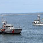 DAN HAMMOCK | THE DAILY WORLD
Coast Guard Station Grays Harbor personnel place the memorial reef at Sundays Blessing of the Fleet in Westport. In the background is commercial troller Brittany May, one of four commercial vessels to join in the ceremony.