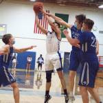 RYAN SPARKS | THE DAILY WORLD
Elmas Cobey Moore (10) puts up a shot against La Center during Elmas 61-47 victory in the 1A District 4 semifinals on Wednesday in Elma.