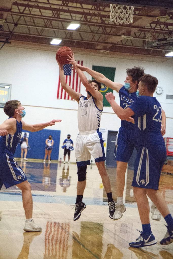 RYAN SPARKS | THE DAILY WORLD
Elmas Cobey Moore (10) puts up a shot against La Center during Elmas 61-47 victory in the 1A District 4 semifinals on Wednesday in Elma.