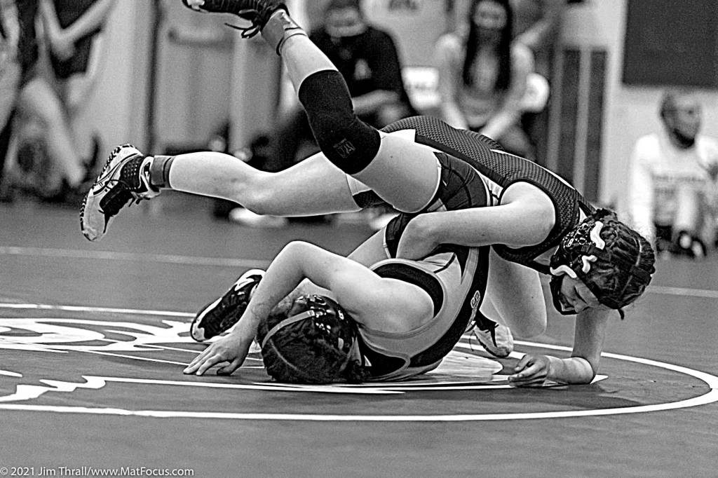 NIC CORTEZ/ MATFOCUS.COM
Aberdeen 105-pound wrestler Madelynn Machowek, top, was one of 10 Bobcat wrestlers to win individual district titles Tuesday in Tumwater.