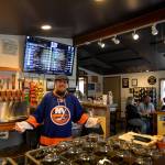 Photos by DAVE HAVILAND/)THE DAILY WORLD
Beer manager Chris Shifman welcomes Friday visitors to Ocean Pours Taproom in Ocean Shores.