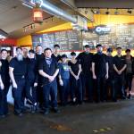 Employees of Bennetts Fish Shack in Ocean Shores took a moment out of their busy lunch rush Friday to pose for a photo, which was followed by a round of applause from the diners.