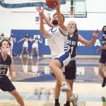 RYAN SPARKS | THE DAILY WORLD Elmas Nick Church goes up for a shot against Kings Way Christians Ty Mairs (21) during the 1A District 4 Championship game on Saturday in Elma.