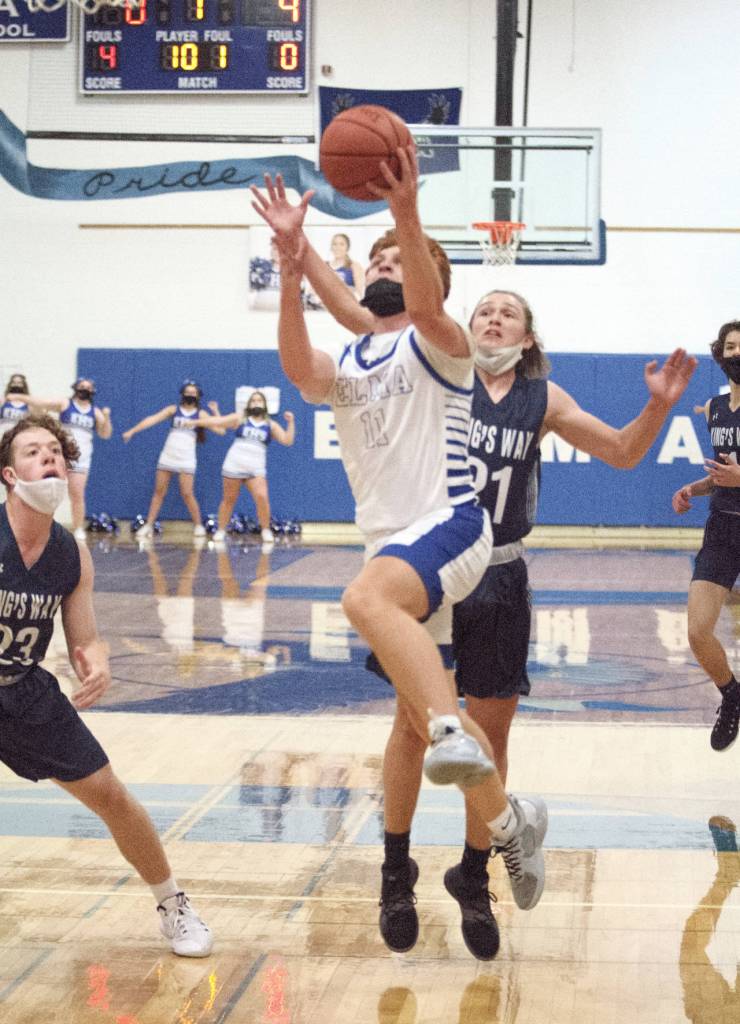 RYAN SPARKS | THE DAILY WORLD Elmas Nick Church goes up for a shot against Kings Way Christians Ty Mairs (21) during the 1A District 4 Championship game on Saturday in Elma.