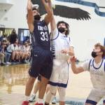 RYAN SPARKS | THE DAILY WORLD Elmas Sawyer Witt (13) attempts to block the shot of Kings Way Christians Evan Hernandez during Saturdays 1A District 4 Championship game at Elma High School.