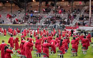 DAN HAMMOCK | THE DAILY WORLD 
Hoquiam High Schools newest class of graduates tosses its mortarboards into the air at the conclusion of the 2021 graduation ceremony at Olympic Stadium Sunday.