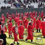 DAN HAMMOCK | THE DAILY WORLD 
Hoquiam High School seniors find their seats at Olympic Stadium on Sunday. Students were allowed eight tickets each, with families socially distanced and masked in the stands.