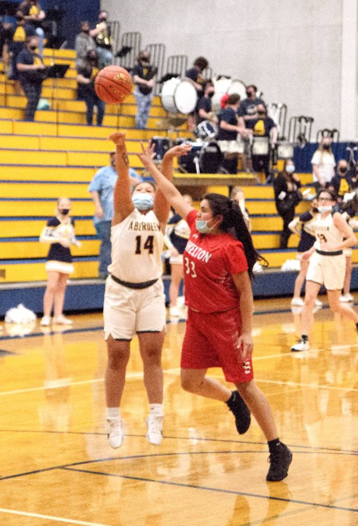 RYAN SPARKS | THE DAILY WORLD Aberdeens Kaely Chum puts up a shot against Sheltons Dydemus Cordova during the Bobcats 54-34 victory in a 2A District 4 playoff game Monday in Aberdeen.