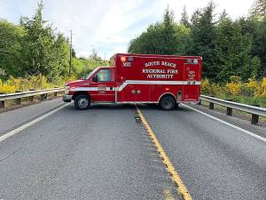A South Beach Regional Fire Authority vehicle blocks State Route 105 near the scene of a double-fatality two-car crash near OLeary Creek Monday afternoon. (Courtesy Washington State Patrol)