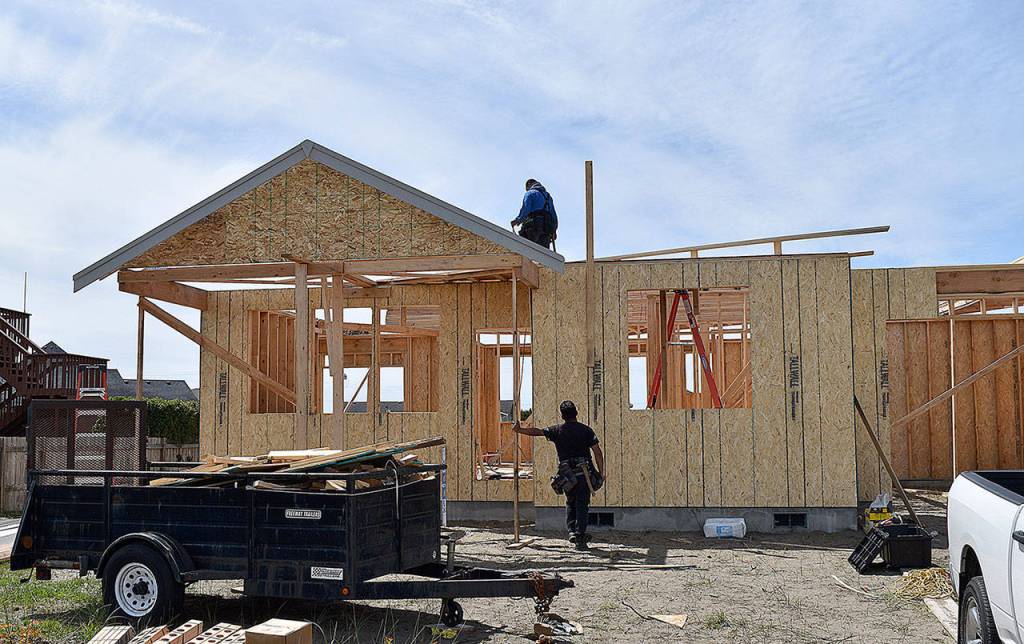 DAN HAMMOCK | THE DAILY WORLD
A two-man crew works on a new single family home on Fairwood Drive SW in Ocean Shores, one of dozens of new builds popping up in the city every month.