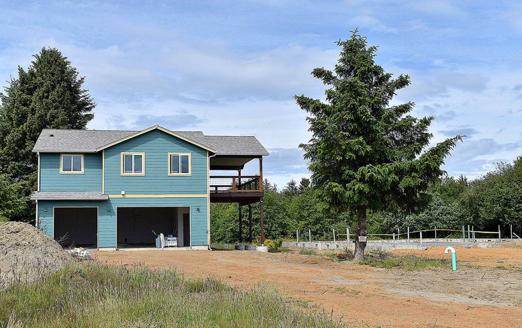 DAN HAMMOCK | THE DAILY WORLD 
New home construction is visible throughout Ocean Shores. This Point Brown Avenue home appears to be near complete, with the foundation started on the adjacent property.