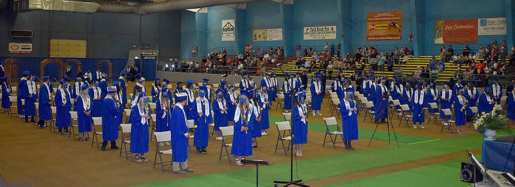 DAN HAMMOCK | THE DAILY WORLD
Elma High School seniors file into the Elma fairgrounds arena for their graduation Saturday. A total of 106 students were slated to graduate this year.