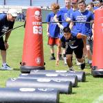 The annual Steve Paul golf tournament, dinner and auction to benefit Grays Harbor Youth Athletics and its annual free football camp, is July 10. Here, Doug English coaches at the camp at Hoquiams Olympic Stadium. English is a college football hall of fame inductee who played defensive tackle for the Detroit Lions from 1975-1985. (Courtesy Grays Harbor Youth Athletics)