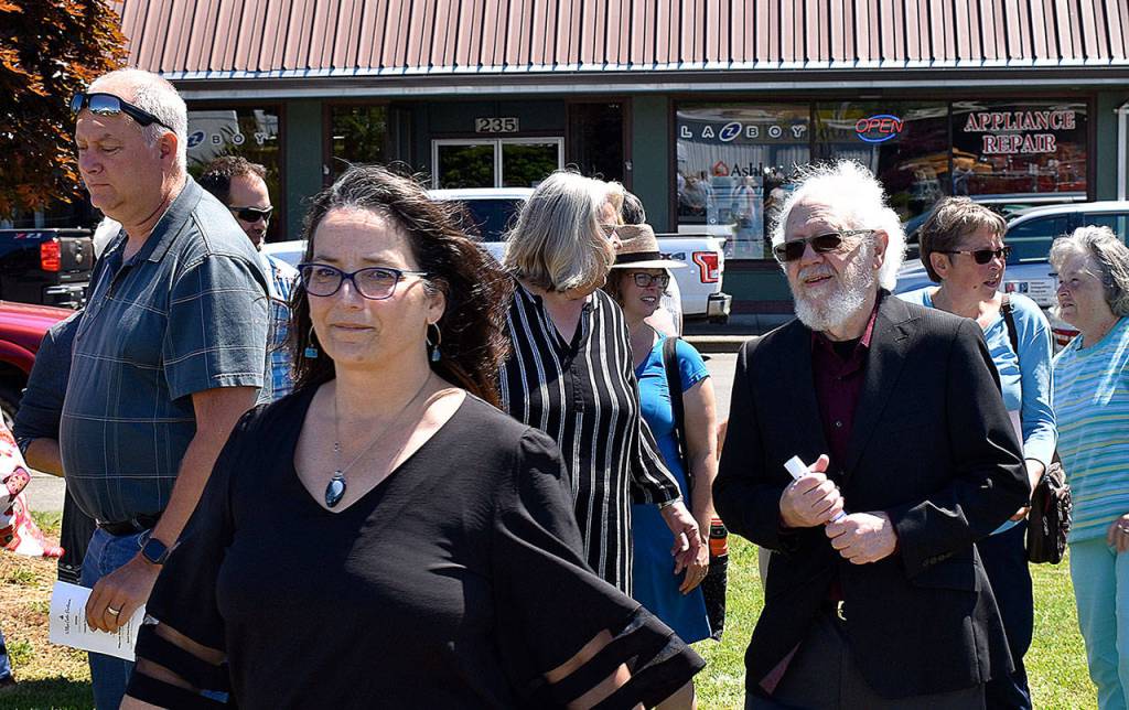 DAN HAMMOCK | THE DAILY WORLD 
Joint Pacific County Housing Authority Executive Director Jennifer Westerman leads Raymond Mayor Tony Nordin to the podium at the groundbreaking ceremony for the Willapa Center in Raymond Thursday.