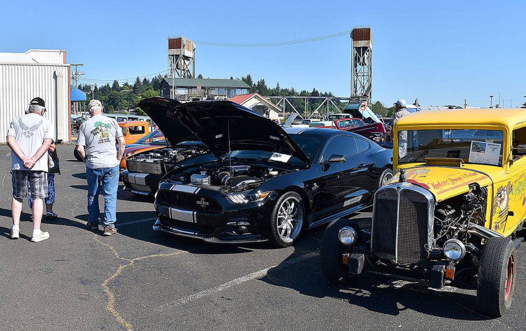 DAN HAMMOCK | THE DAILY WORLD 
A little something for everyone who loves cars was at the Hoquiam Pushrods River Run Revival car show on Levee Street Saturday. In the foreground is a 1932 Pontiac registered to David Rowe of South Bend. Its sitting next to a newer model Shelby.