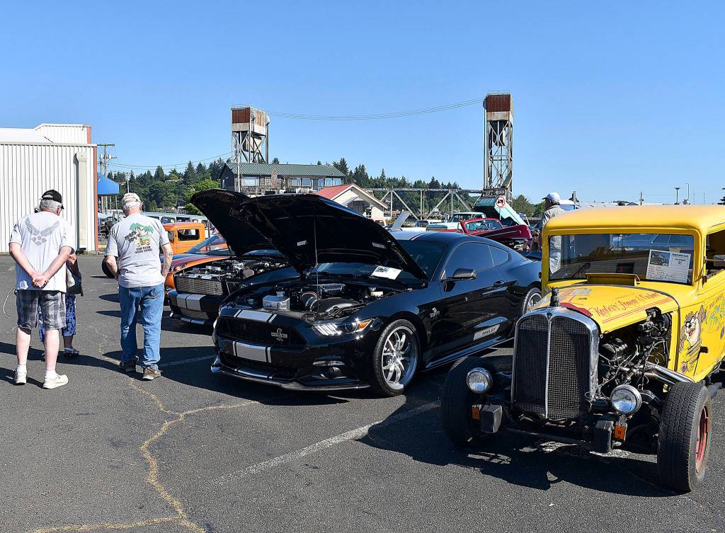 DAN HAMMOCK | THE DAILY WORLD 
A little something for everyone who loves cars was at the Hoquiam Pushrods River Run Revival car show on Levee Street Saturday. In the foreground is a 1932 Pontiac registered to David Rowe of South Bend. Its sitting next to a newer model Shelby.