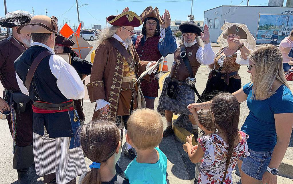 DAN HAMMOCK | THE DAILY WORLD 
The Columbia River Association of Pirates, who call themselves the C.R.A.P. Crew, recruit new crew members at Rusty Scuppers Pirate Daze in Westport on Saturday.