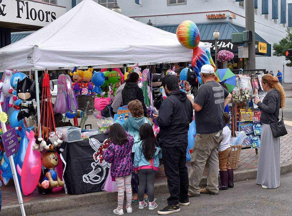 DAN HAMMOCK | THE DAILY WORLD 
Brightly colored inflatable animals, swords and the like were popular among the younger revelers at Saturdays Aberdeen Founders Day celebration.