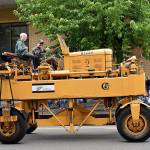 DAN HAMMOCK | THE DAILY WORLD 
Polson Museum Director John Larson gives the thumbs-up as he pilots the museums old Hyster lumber carrier down Market Street during Saturdays Aberdeen Founders Day parade.