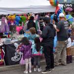 DAN HAMMOCK | THE DAILY WORLD 
Brightly colored inflatable animals, swords and the like were popular among the younger revelers at Saturdays Aberdeen Founders Day celebration.