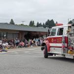 DAVE HAVILAND | THE DAILY WORLD 
The McCleary Fire Department truck rounds the corner onto 3rd Street during the 62nd Annual Grand Parade this year.