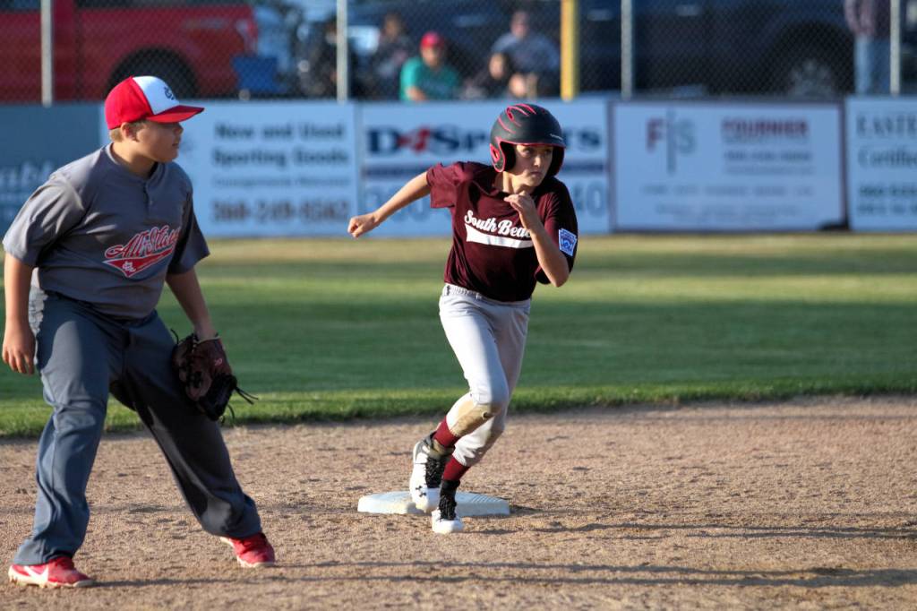 RYAN SPARKS | THE DAILY WORLD South Beachs Brayden Dungey races around the bases after belting a run-scoring double in a 12-6 victory over Capitol National in the championship game of the 10-12 TOC Tournament on Tuesday in Montesano.