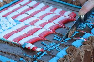 DAILY WORLD FILE PHOTO
Cutting the cake during a National Night Out block party in 2018.