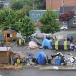 DAVE HAVILAND | THE DAILY WORLD 
Residents of Aberdeens TASL camp prepare to move Friday as the noon camp closure approaches. This photo was taken from the third floor City Council chambers at City Hall.