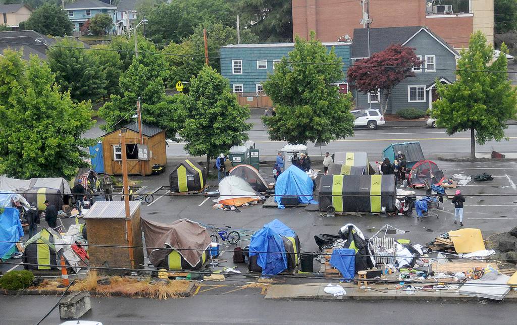 DAVE HAVILAND | THE DAILY WORLD 
Residents of Aberdeens TASL camp prepare to move Friday as the noon camp closure approaches. This photo was taken from the third floor City Council chambers at City Hall.