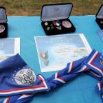 DAVE HAVILAND | THE DAILY WORLD Awards, pins and new neckerchiefs for Hoquiam Boy Scouts of America Troop 100s newest Eagle Scouts.