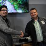 DAVE HAVILAND | THE DAILY WORLD
The "Best Overall Business" award goes to the top voted business in The Daily World's "Best of Twin Harbors" awards. Publisher Mike Hrycko congratulates Adam Bakotich