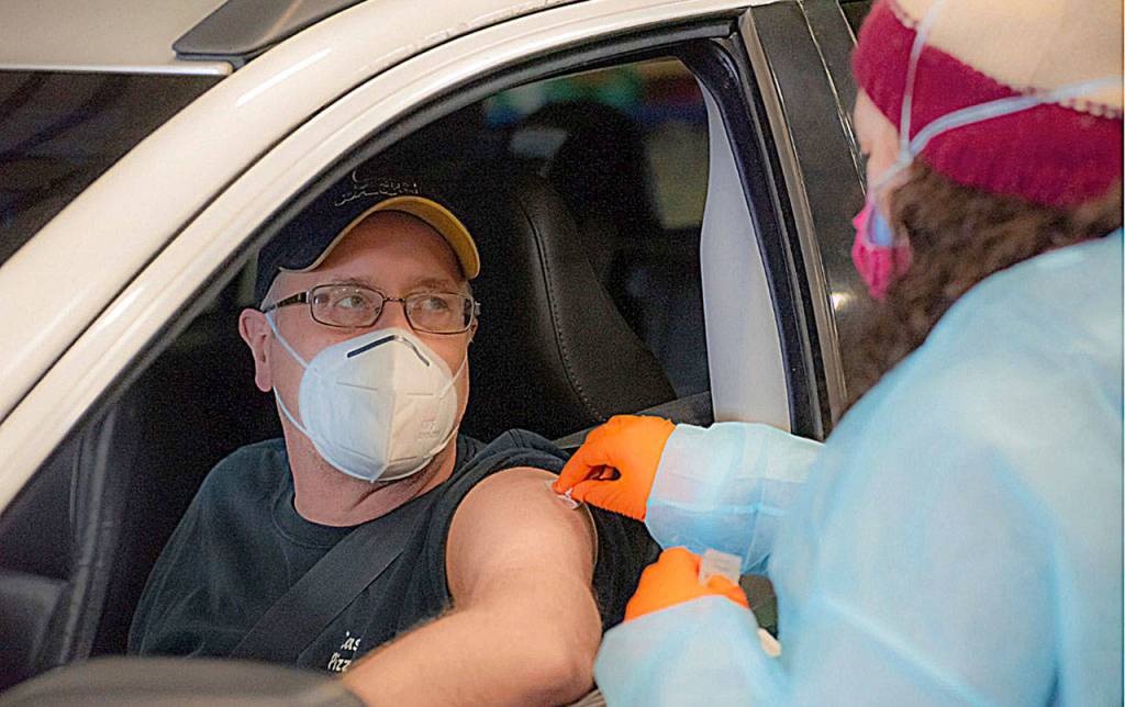 courtesy of Chris Majors 
A vaccination at the mass clinic at the Port of Grays Harbor in January, when vaccine demand was high and supplies were limited. Now vaccines are available at numerous providers across the county.