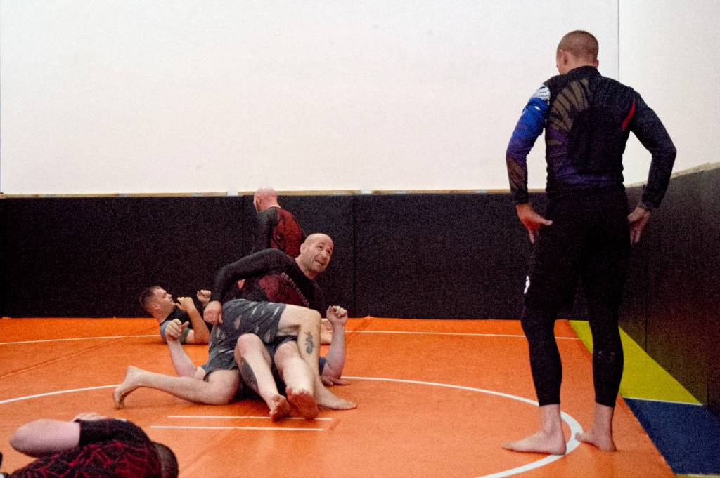 RYAN SPARKS | THE DAILY WORLD 
Grays Harbor BJJ owner/operator Joe Marchie, top, demonstrates techniques to student Rob Verboomen, right, during a Friday evening class in Aberdeen.