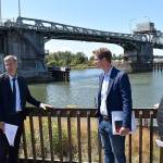 DAN HAMMOCK | THE DAILY WORLD 
From left, Port of Grays Harbor Deputy Executive Director Leonard Barnes, Hoquiam City Administrator Brian Shay, Congressman Derek Kilmer and Hoquiam Mayor Ben Winkelman stand behind the Hoquiam Farmers Market on Friday discussing the alignment of the North Shore Levee and its extension, the North Shore Levee West Segment.