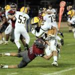 PHOTO BY BEN WINKELMAN Aberdeens Trey Anderson attempts to avoid the tackle of Hoquiams Zander Jump (10) during Aberdeens 40-8 victory in the 116th Myrtle Street Rivalry on Friday at Olympic Stadium in Hoquiam.