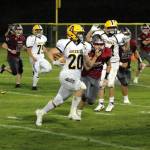 PHOTO BY BEN WINKELMAN Aberdeen running back Jeremy Sawyer (20) ran for 149 yards and a touchdown to lead the Bobcats to a 40-8 victory over Hoquiam on Friday in Hoquiam.