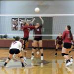 RYAN SPARKS | THE DAILY WORLD Montesano middle blocker Addie Winter (13) defends against WF Wests Ava Olsen during the Bulldogs 3-2 season-opening win on Tuesday at Bo Griffin Memorial Gymnasium in Montesano.