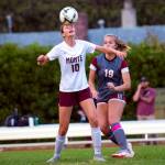 ERIC TRENT | THE CHRONICLE Montesanos Mikayla Stanfield (10) heads the ball in front of WF Wests Kyla McCallum during the Bulldogs 2-1 victory on Tuesday in Chehalis.