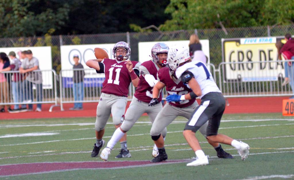 RYAN SPARKS | THE DAILY WORLD Montesano quarterback Jayden McElravy (11) throws a touchdown pass in the first quarter of a 43-0 victory over Cascade Christian on Friday in Montesano.