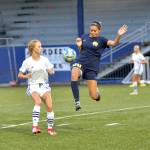 RYAN SPARKS | THE DAILY WORLD Aberdeens Jaylynn Phimmasone (20) leaps to make a play against Elmas Aaleigha Weld on Saturday in Aberdeen.