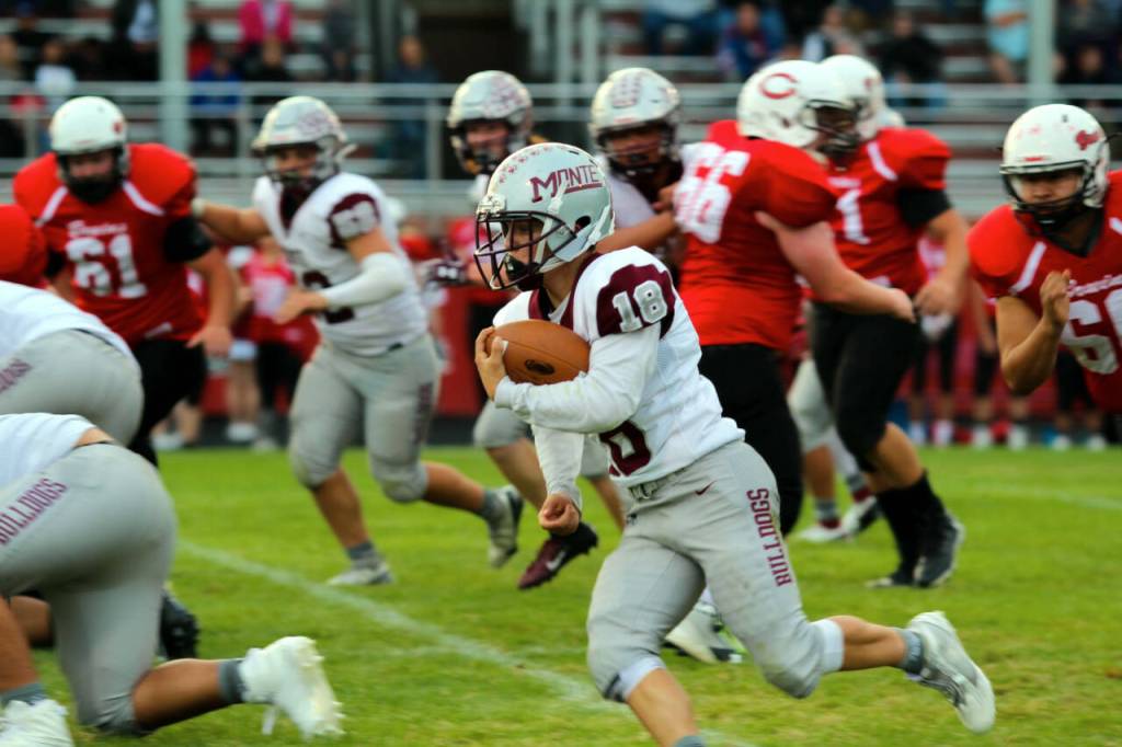 PHOTO BY SHAWN DONNELLY Montesano running back Jacob Salstrom (18) carries the football during the Bulldogs 53-0 win over Columbia-White Salmon on Thursday in Columbia.