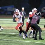 RYAN SPARKS | THE DAILY WORLD Pe Ell-Willapa Valley running back Derek Fluke carries the ball during the Titans 42-7 victory over Raymond-South Bend on Friday in South Bend.