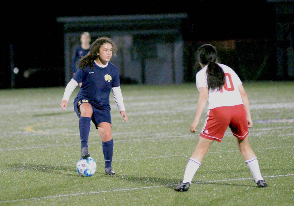 RYAN SPARKS | THE DAILY WORLD Aberdeen midfielder Dominique Trevino, left, controls possession against Hoquiams Jemima Perez during the Bobcats 1-0 victory on Saturday in Aberdeen.