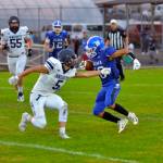 RYAN SPARKS | THE DAILY WORLD Elma receiver René Duran (18) avoids the tackle of Kings Way Christian defender Matthew Belefski during the Eagles 66-25 victory on Friday in Elma.