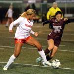 RYAN SPARKS | THE DAILY WORLD Montesanos Vanna Prom (24) and Teninos Alivia Hunter jostle for possession during Montesanos 1-0 win on Tuesday at Jack Rottle Field in Montesano.