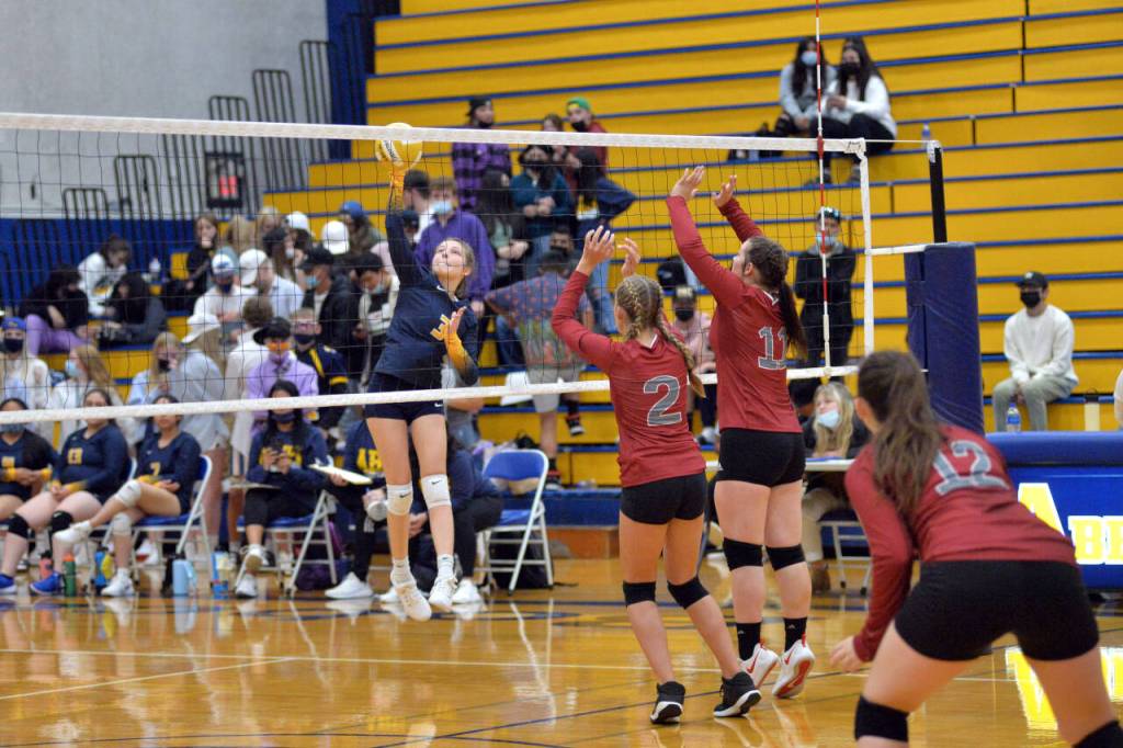 RYAN SPARKS | THE DAILY WORLD Aberdeens Emmersyn Yakovich (3) smashes a kill against WF Wests Mari Ceesay (2) and Savannah Hawkins during Aberdeens 3-1 loss on Thursday in Aberdeen.