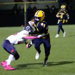 RYAN SPARKS | THE DAILY WORLD Aberdeen running back Trey Anderson (44) is tackled by Black Hills defender Marcos Elliott after catching a pass for a first down during Aberdeens 20-7 victory on Friday in Aberdeen.